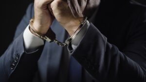 A handcuffed man needs a Mansfield criminal defense lawyer.